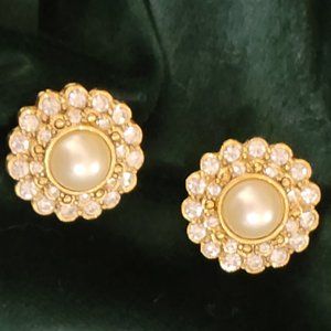 gold toned pierced earrings with a center pearl and rhinestones
